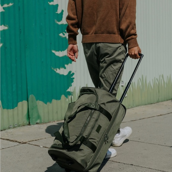 Calpak Bags Gently Used Stevyn Rolling Duffel By Calpak Poshmark